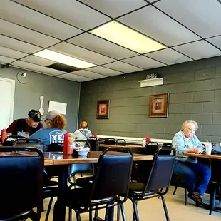 people sitting at long tables