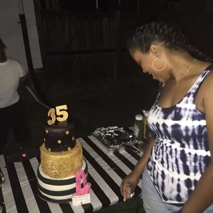a woman cutting a cake