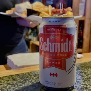 a can of schmidt beer on a counter
