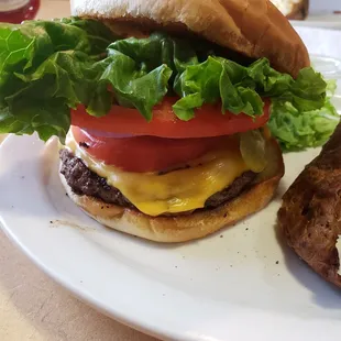 Burger with all the fixings and an extra tomato