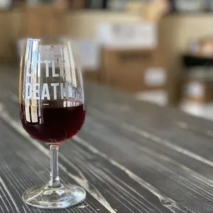 a glass of wine on a table