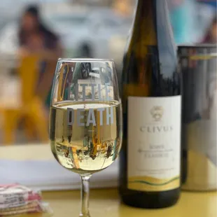 a glass of wine and a bottle of wine