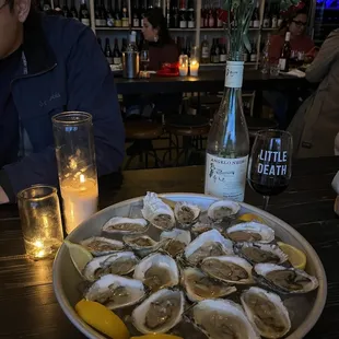 a plate of oysters on a table