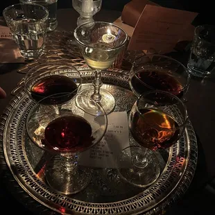 a silver tray with wine glasses on it