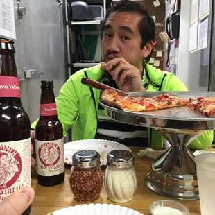 Eating great pizza drinkin beers in the kitchen area. So fun!