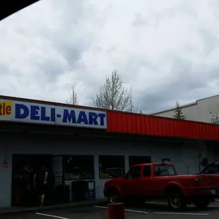 a red truck in a parking lot