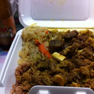 Curried goat, peas and rice, cabbage and carrots