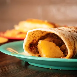 a tasty looking burrito on a plate