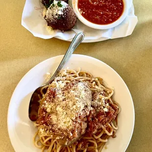 Rice balls (arancini) (top) and spaghetti and meatballs (bottom)