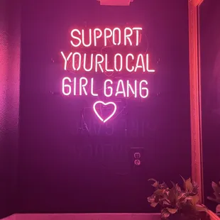 Neon sign #1 of 2 in the powder/prep space in between the gender neutral restrooms.