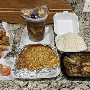 crab Rangoon with sauce, free egg rolls, Hong Kong pan fried noodles, steamed white rice, Kra Prow (spicy basil) with chicken