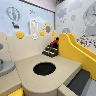 Climbing area with a trampoline and slide