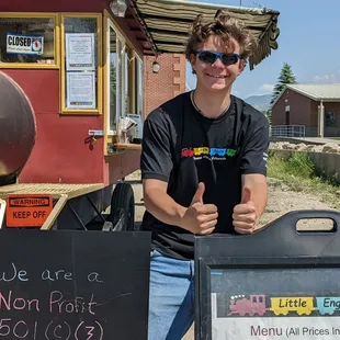 a man giving a thumbs up