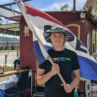 a boy holding a flag