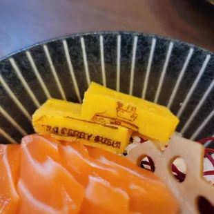 a close up of a plate of sushi
