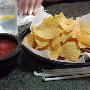 Light &amp; thin tortilla chips with punchy salsa.