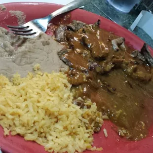 a plate of food with rice and beans