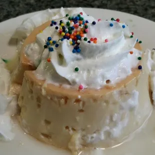 Very substantial flan. Sprinkles offer crunchy texture contrast to creamy custard &amp; whipped cream.