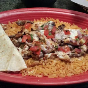 Fajabo (steak &amp; chicken on rice) with steaming hot flour tortilla.