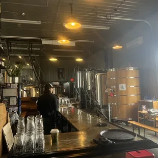 a woman standing at the bar