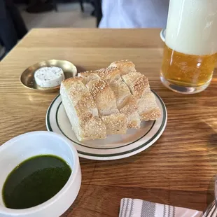 a plate of food and a glass of beer