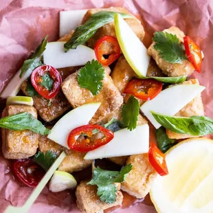 Crispy tofu drizzled with spiced cider syrup and served with crisp apple slices and pickled chiles. (Vegan and Gluten Free)
