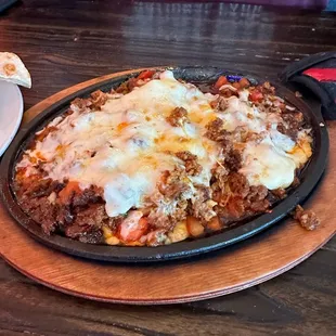 Queso skillet with chorizo and tomatoes