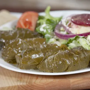 Have you ever tried our Dolmades? If not, you are totally missing out on this amazing Hand-rolled treat! Grape leaves, beef and rice.