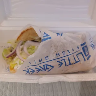 a sandwich in a styrofoam container