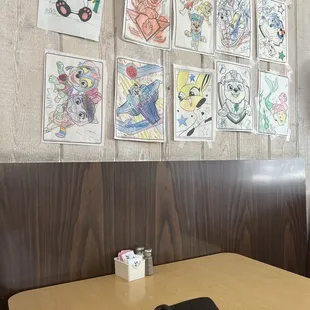 kids art on the walls, i feel like i am home lol.