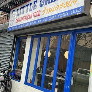 a motorcycle parked in front of a restaurant