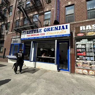 a man walking in front of a store