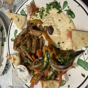 Chicken shawarma with hummus and grilled vegetables