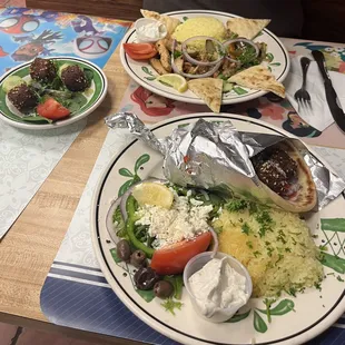 Grilled chicken over rice, 3 extra falafel,  and a falafel gyro plate.