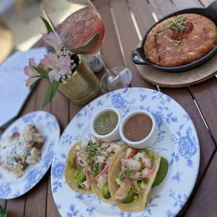 Rose sangria, street tacos (shrimp), stuffed hash browns, and almond croissant