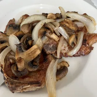 two pork chops main , had for lunch - easily a two maybe 3 person meal came with soup, bread, spaghetti, veggies !