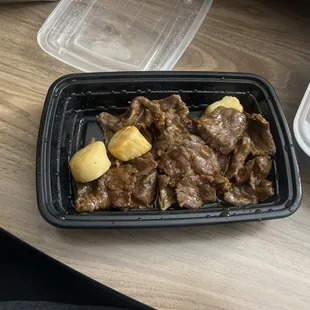 beef and potatoes in a plastic container