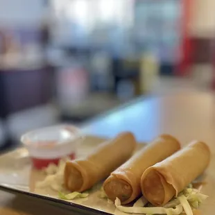 three rolls of food on a plate