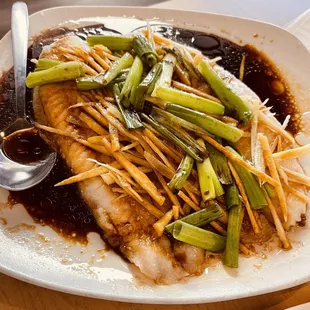 Are as med fish with ginger and scallions