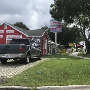 a truck parked in front of a store