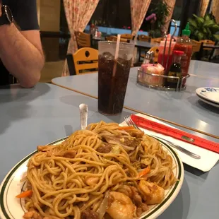 a plate of noodles and shrimp