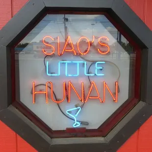 a neon sign in a window