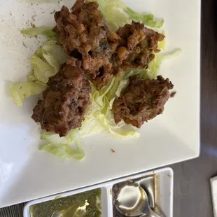 Vegetable Pakoras. YUM!! These crunchy little bundles of joy with cauliflower, onion, spinach served with a delectable fresh mint sauce.