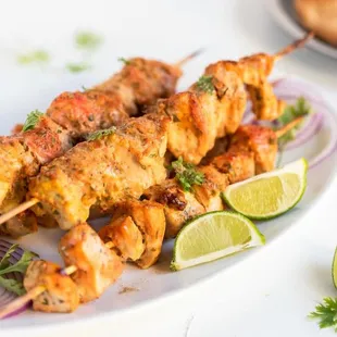 chicken skewers on a plate