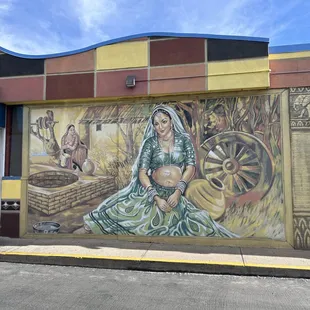 Murals in the parking lot of the restaurant. YES there is free parking.