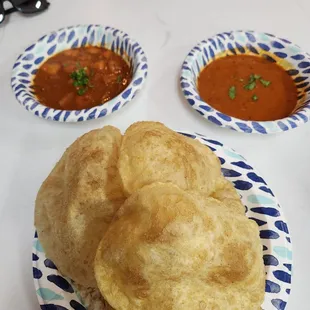 Thali meal - rice, poori, daal, and subji