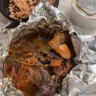 Spicy and oily stewed chicken. So oily that the potatoes were orange, like yams except they&apos;re white potatoes.