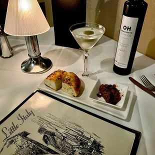 Tito's Martini, Tomato Basil Focaccia with Tapenade on a candle lit table