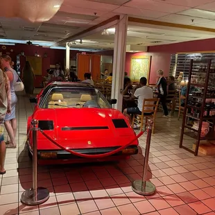 a red sports car on display