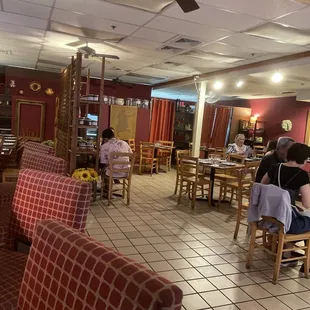 a dining area with a ceiling fan